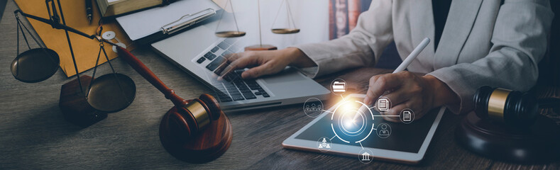 Justice and law concept. Gavel on sounding block in hand's Male judge at a courtroom, working with document law books, report the case on table in modern office.