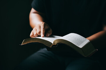 Young man reading and study holy bible, Concept of faith for god.