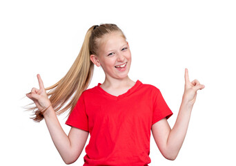 Portrait of a happy smiling girl in a red T-shirt raising her hands up in a sign, isolated on a white background