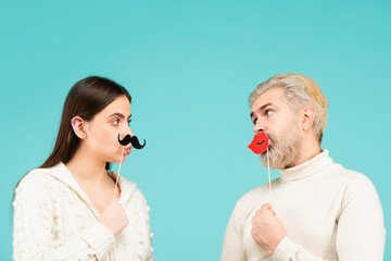 Gender concept. Female and male sex icon. Funny couple of woman with moustache and man with red lips. Identity transgender, gender stereotypes.