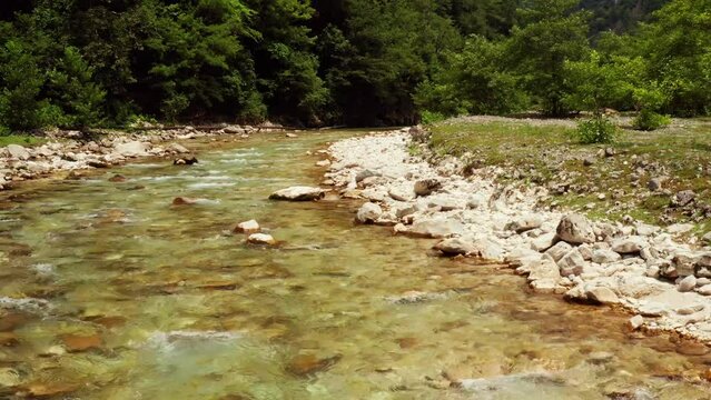 Low slow flight over a mountain river. River Abasha in Georgia