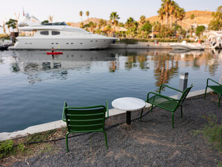 Fototapeta na wymiar empty marble table in front of marina background, close up