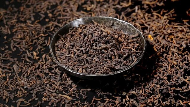 puerh tea leaves in a bowl. close up. Macro.  view on turntable