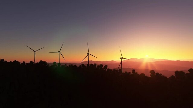 Aerial flight at sunset over several wind turbines of renewable energy wind farms in Santa Ana. Costa Rica