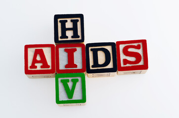 Wood blocks spelling AIDS HIV on white background