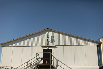 Fototapeta premium Old building in city. Industrial area. Details of industrial-looking architecture.