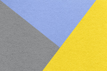Fototapeta premium Texture of craft gray, yellow and blue shade color paper background. Structure of vintage abstract cardboard