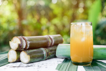 Fresh squeezed sugar cane juice,  Sugar cane juice, Sugar cane drink with ice, blur background