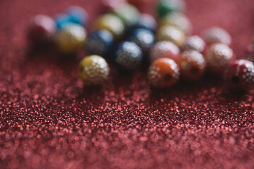 Colorful Balls With Red Glitters In Boke, Colorful Balls In Red Background