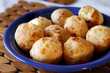 various cheese bread on a plate - Minas Gerais food