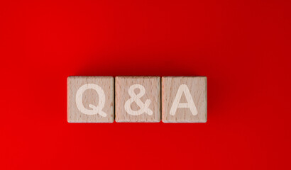 Wood blocks spelling Q&A on red background