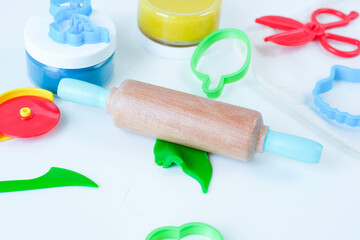 Homemade modeling clay tools kit. Colorful plasticine with roller. Home education game with play dough. High quality photo