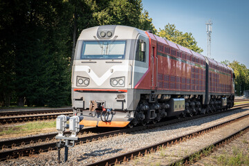 Fototapeta premium Diesel railway locomotive. Logistics infrastructure. Sunny day