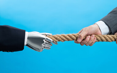 Human and robot play tug of war