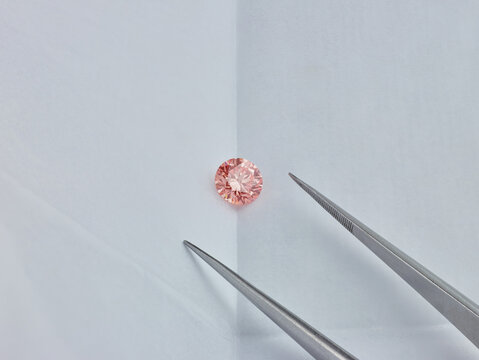 Pink Diamond in Gemstone Parcel with Tweezers