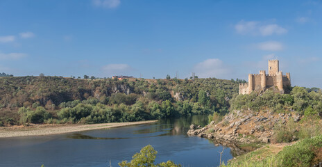 Fototapeta na wymiar Panoramic view at the Castle of Almourol is a medieval castle atop the islet of Almourol in the middle of the Tagus River