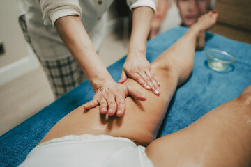 masseur doing a lymphatic drainage to a client in a beauty center