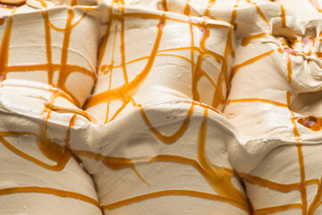 Frozen Caramel flavour gelato - full frame detail. Close up of a white surface texture of Ice cream...