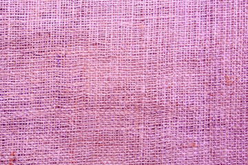 Texture of pink burlap fabric as background, top view