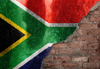 South Africa flag on broken brick wall