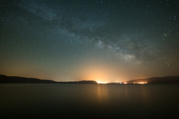 Fototapeta na wymiar Milky Way Core over Salda Lake at Night. Starry Sky and Light Pollution. Burdur Province, Turkey.