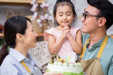 Young Asian family, birthday party