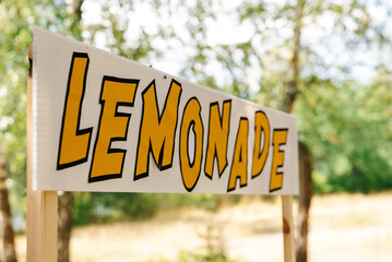 An empty lemonade stand ready for children to start selling lemonade on a hot summer day as their first business endeavor