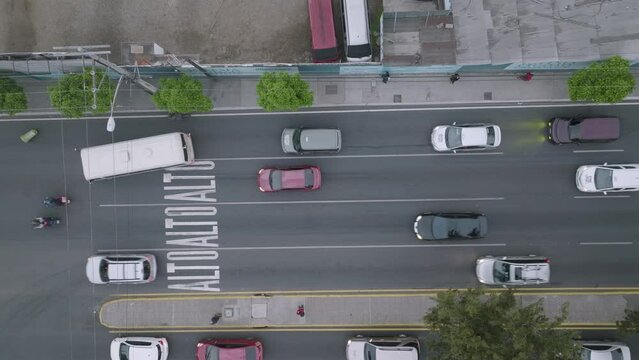 Static top down aerial footage of an intersection in Guatemala City, Guatemala with traffic in the morning.