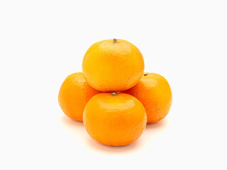 Pile of fresh oranges over a white background