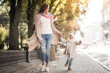 Fototapeta premium Mother with little daughter having fun together 