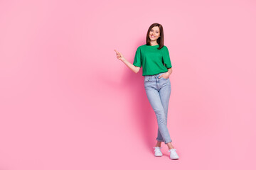 Full body photo of stunning young girl hold hand pocket point empty space dressed trendy green...
