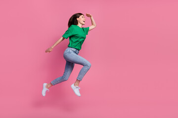 Fototapeta na wymiar Full body profile portrait of crazy active lady jump run look empty space isolated on pink color background