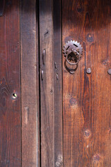 Old wooden door with iron handle 