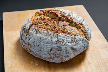 loaf of bread on a wooden board