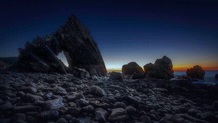 Twilight at Black Church Rock on the coast of Devon, UK