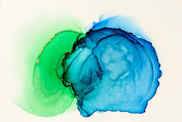 Abstract alcohol ink fluid art background. Green and blue color