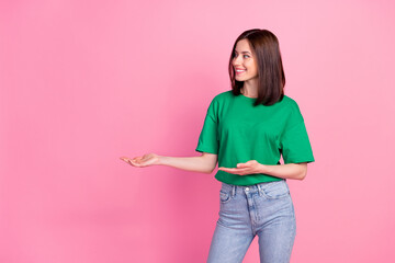 Photo portrait of lovely young lady palm direct empty space shopping promo dressed trendy green...