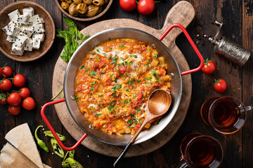 Menemen, Turkish breakfast, eggs with peppers and tomatoes, top view