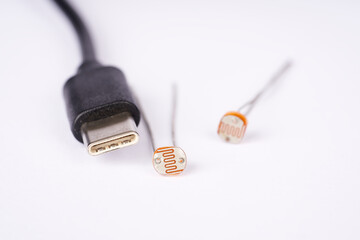 Electronic parts photoresistor and
USB cable connector c on the white background.