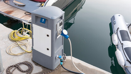 Charging station for boats, electrical outlets to charge ships in harbor. Electrical power sockets...