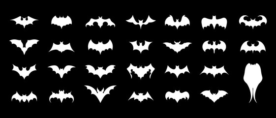 Fototapeta premium Bats icons set. White flat silhouettes of bats. Icons for Halloween design. Vector illustration isolated on black background.