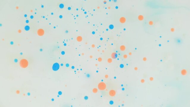 orange and blue ink bubbles background texture cosmetic rotating 