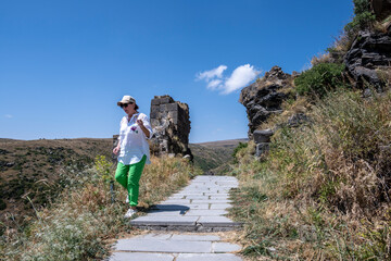 ancient stone dilapidated fortress in a picturesque place in the mountains of Armenia