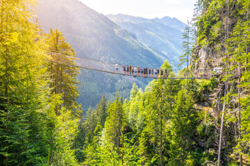 Metal swing bridge over the Riesach waterfall