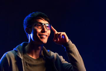 active attractive asian handsome male adult wearing smart glasses hand finer pressing turn function...