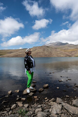 Fototapeta premium landscape with an alpine blue lake against the backdrop of mountains and blue sky in the mountains of Armenia