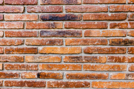 The brown brick wall texture with rough pattern Wallpaper background. Brick wall.