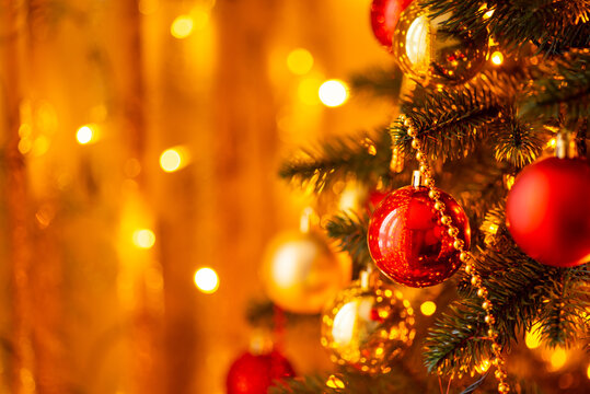 Bright warm colours, decorated christmas tree, garland lights. Christmas and new year concept, copy space