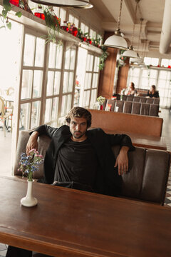 A stylish portrait of a charismatic man in the city 