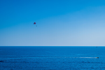 Parasailing above sea in Mediterranean Turkey,  Copy space, holiday fun activities.
